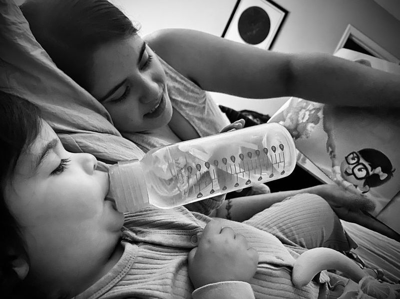 Mother and child reading a personalized book for the two of them.