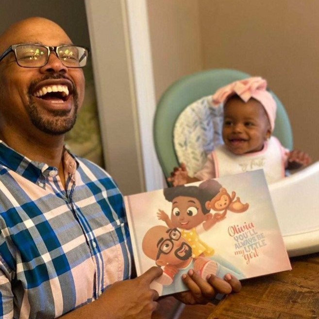 A father and a daughter with the best first Father's day gift.